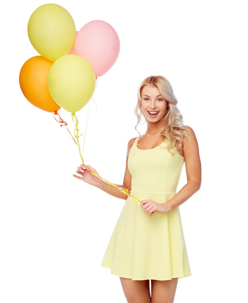 happy woman in dress with helium air balloons - Valokuva, kuva