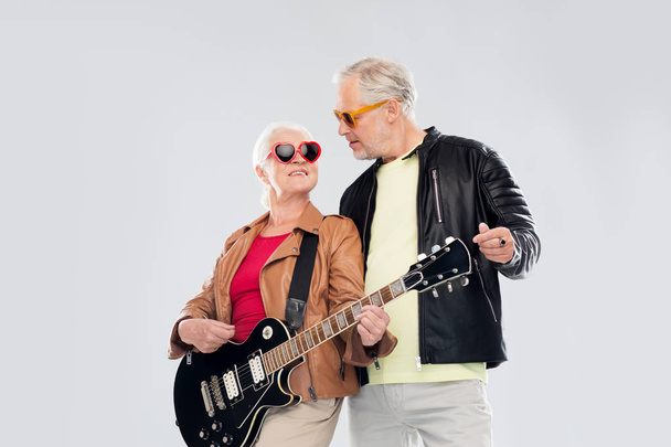 senior couple in sunglasses with electric guitar - Photo, Image