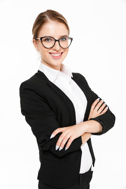 Vertical image of smiling blonde business woman in eyeglasses - Фото, зображення