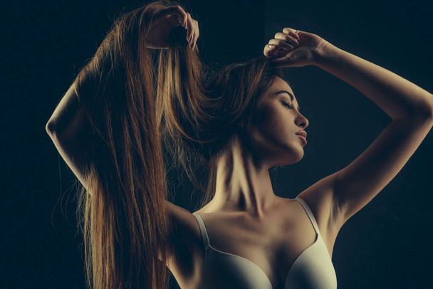 woman with long healthy hair in underwear bra - Photo, image