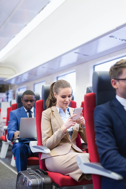 Business people in a train - Φωτογραφία, εικόνα
