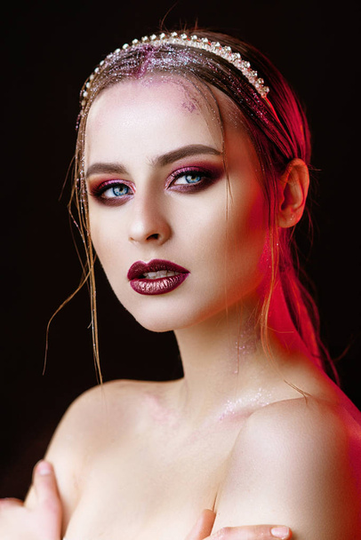 portrait of a girl with a gold crown. Model with creative make-up. - Fotó, kép