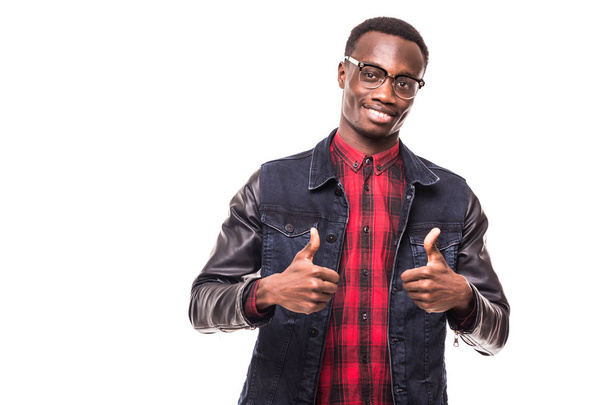 Portrait of a very happy afro American showing thumbs up in studio on white isolated background - Foto, immagini
