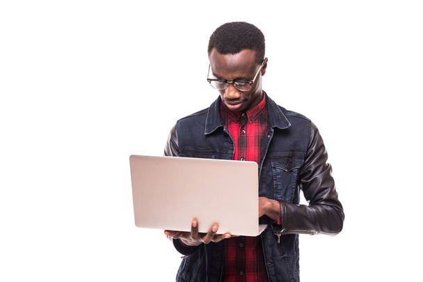 Portrait of happy afroamerican man using laptop on white background - Foto, afbeelding