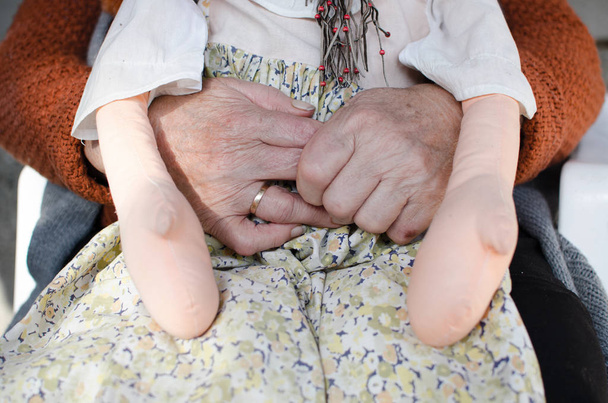 Caregiver, carer hand holding elder hand in hospice care. Philanthropy kindness to disabled concept. - Фото, зображення