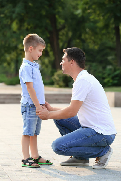 Cute boy with father in park - Foto, Imagen