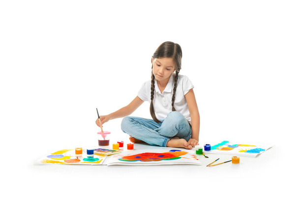 Little cute girl painting picture against white background - Φωτογραφία, εικόνα