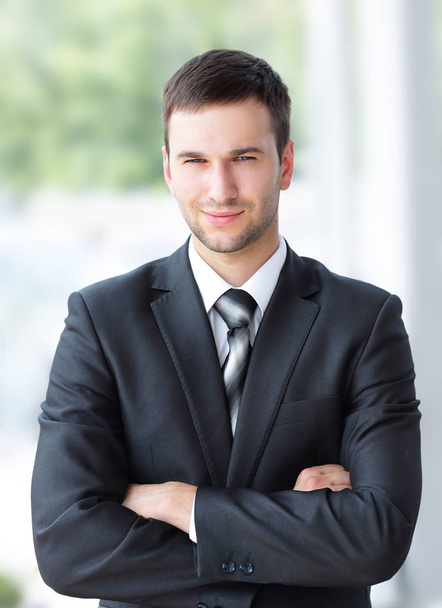 successful businessman standing near window in office. - Photo, Image