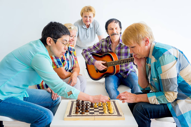 Senior people playing board games - Фото, зображення