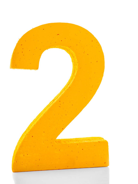 Bright yellow number two for the New Years decoration isolated on a white background. - Foto, Imagem