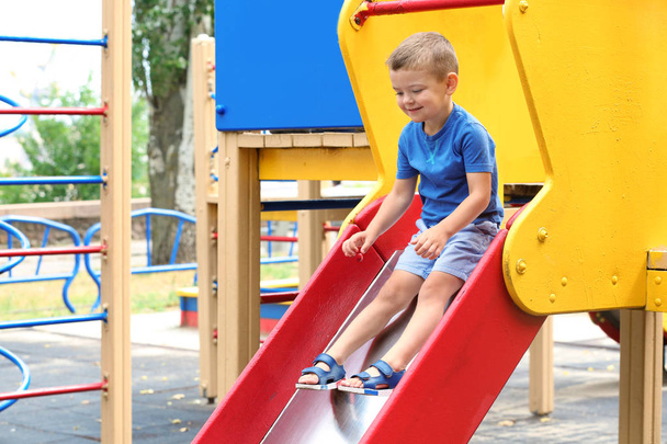 Cute little boy on playground - Foto, imagen