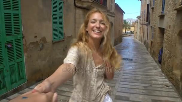 Young Woman Leading a Man to the Adventure in an Old European Town. - Felvétel, videó