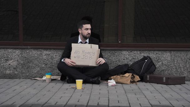 Unemployed businessman on pavement - Photo, Image