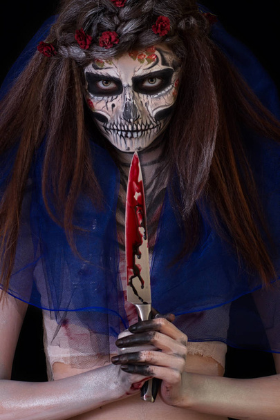 Beautiful girl with scary Halloween make-up - Фото, зображення