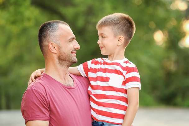 Cute boy with father in park - Photo, image