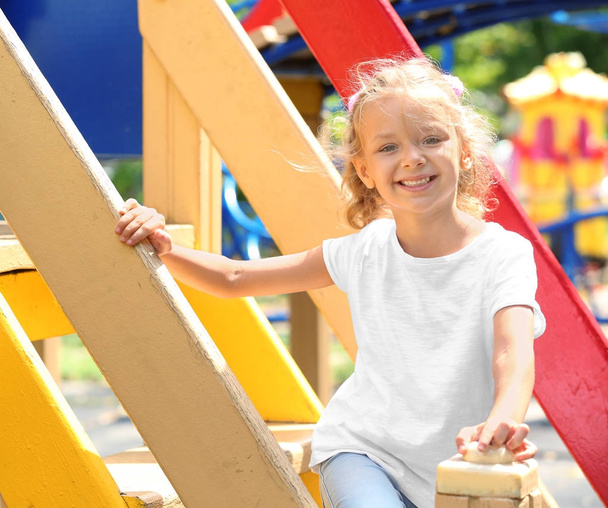Cute little girl on playground - Fotó, kép