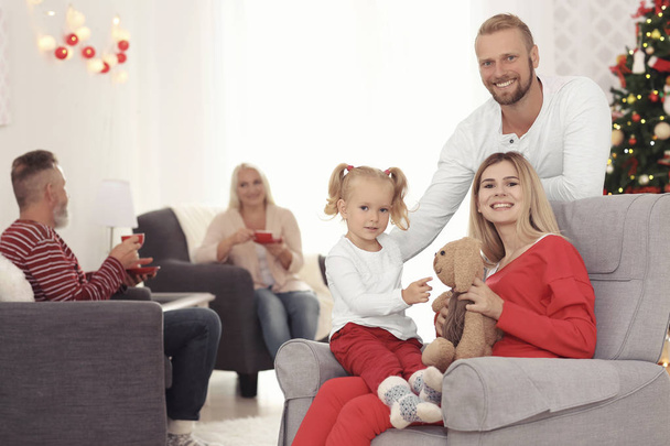 Happy family celebrating Christmas at home - Foto, Imagen