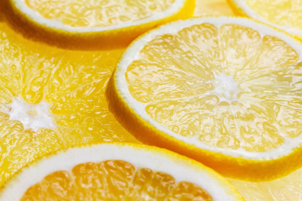 Slices citrus fruits background - Фото, изображение