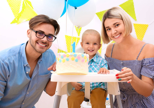 Baby boy with parents and birthday cake at home - Φωτογραφία, εικόνα