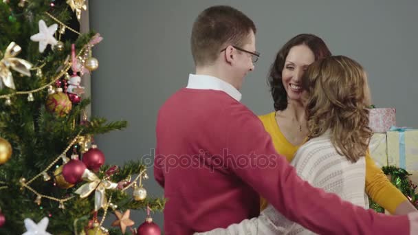 Friendly family hugging, congratulating each other on holidays, idyll at home - Metraje, vídeo