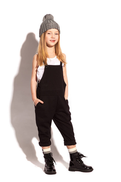Blonde little girl wearing overalls - Фото, зображення