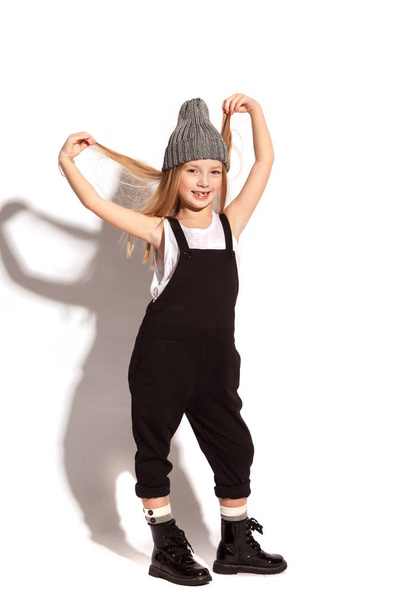 Blonde little girl wearing overalls - Foto, immagini