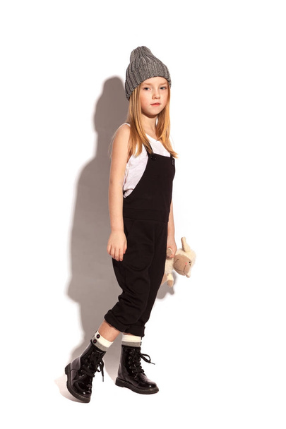 Blonde little girl wearing overalls - Φωτογραφία, εικόνα