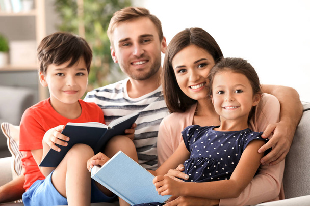 Happy family reading books at home - Fotó, kép