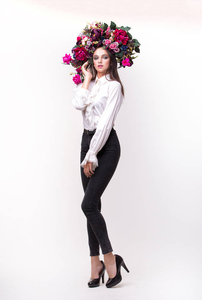 Girl, model in a beautiful image with a wreath of flowers on her - Фото, зображення
