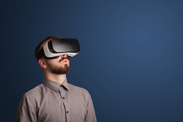 Businessman with virtual reality goggles - Фото, изображение