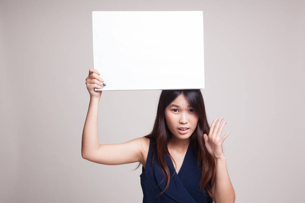 Young Asian woman surprise with white blank sign. - Foto, imagen