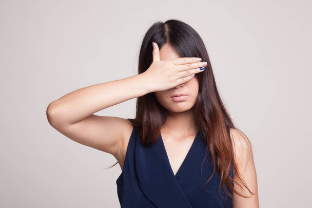 Young Asian woman close her eyes with hand. - Φωτογραφία, εικόνα