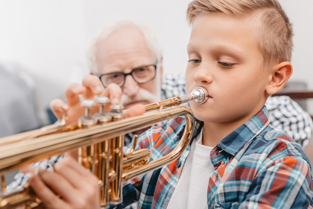 boy practicing trumpet - Photo, Image