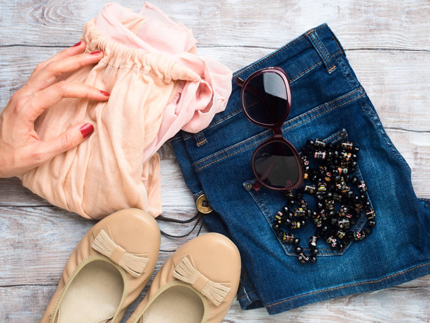 Flat lay with womans clothes, glasses shoes - Photo, Image