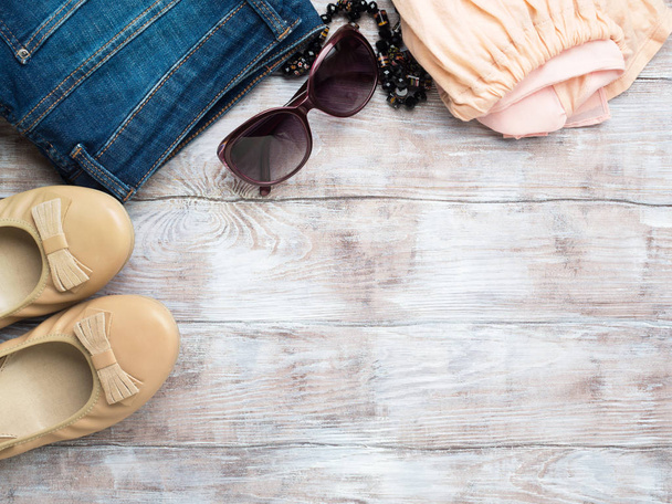 Flat lay with womans clothes, glasses shoes - Photo, Image