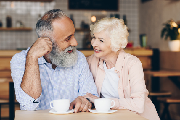 senior couple drinking coffee in cafe - Photo, Image