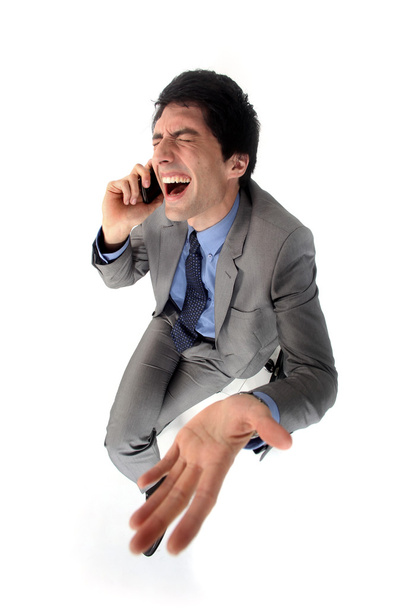 Hysterical businessman on the phone - Foto, imagen
