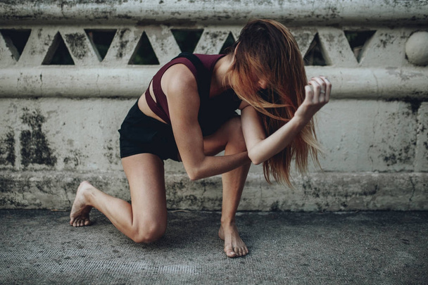 Woman performing dance on the floor. - Foto, Imagen