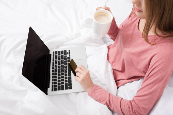 woman with laptop, coffee and credit card - Photo, Image