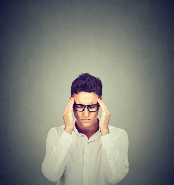 Stressed man thinking intensely concentrating  - 写真・画像