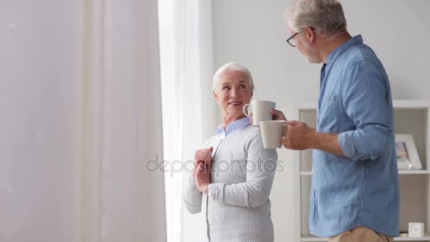 happy senior couple drinking coffee at home - Video, Çekim