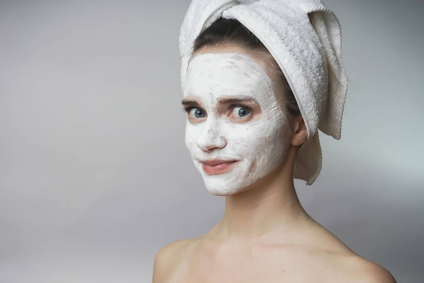 Woman enjoying white spa mack,scrub on face.Clean skin - Foto, Imagem