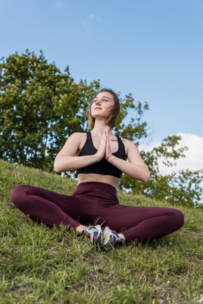 woman sitting in bound angle pose - Foto, Imagen
