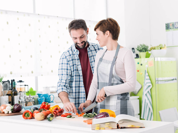 Loving couple cooking together - Photo, Image