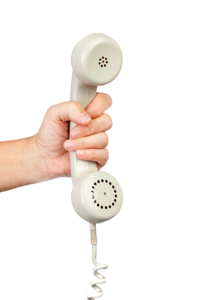 male hand holding white vintage telephone handset isolated on white background - Foto, Imagem