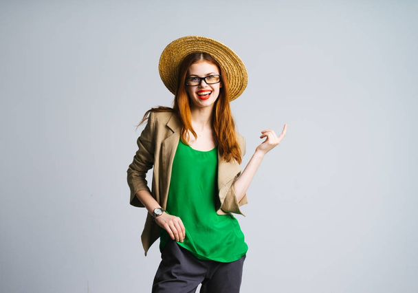 young happy girl in green t-shirt and fashionable hat smiling - Foto, Imagen
