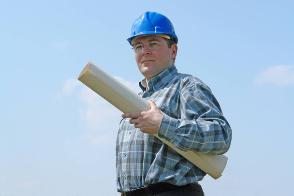 Construction site manager with building plans - Photo, Image
