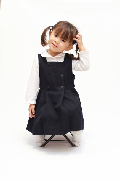 Japanese girl on the chair in formal wear (2 years old) - Foto, imagen