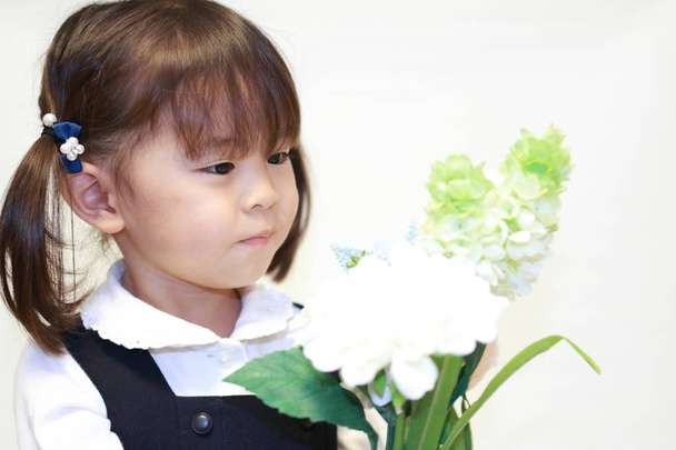 Japanese girl in formal wear with flowers (2 years old) - Photo, Image
