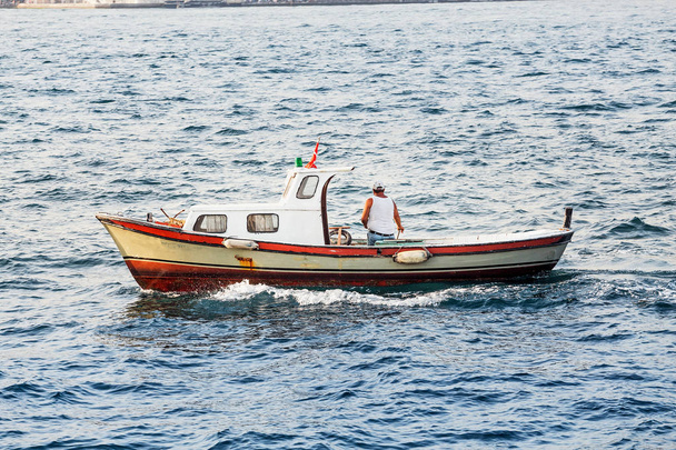 Small fishing boat in the Marmara Sea, Bosporus Strait in Istanbul - Photo, Image